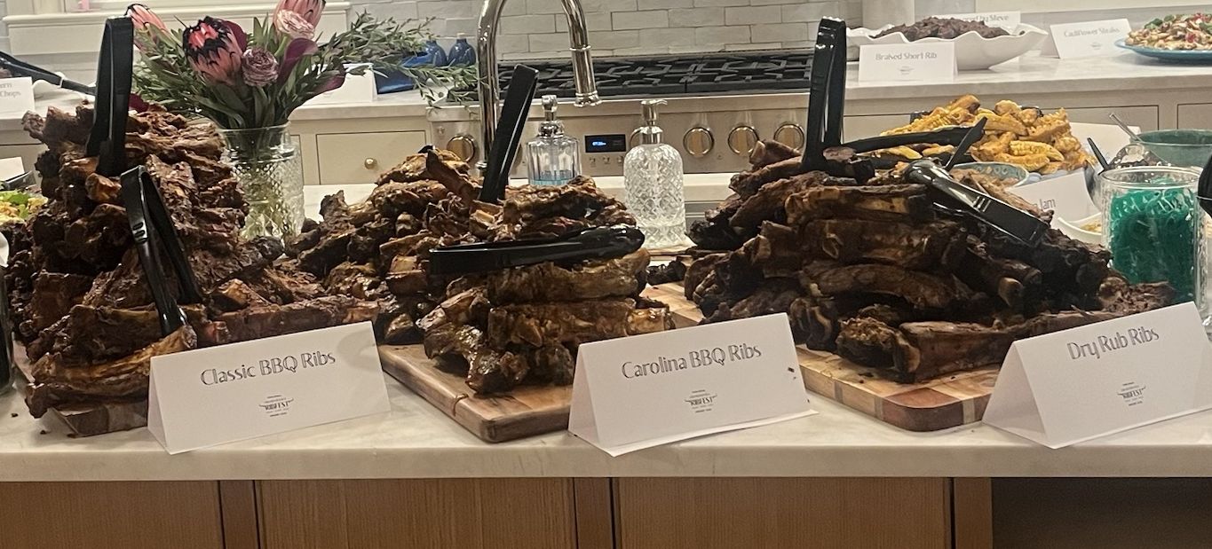 Platters of classic BBQ, Carolina and dry rub ribs on the kitchen island